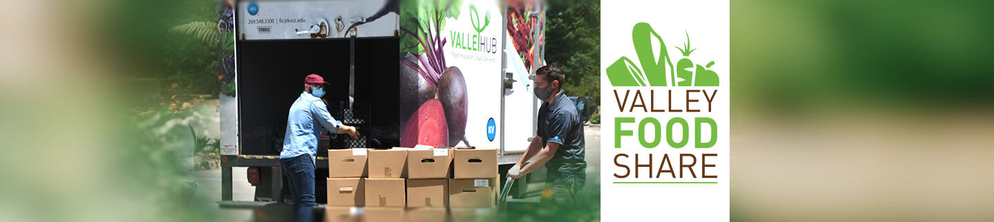 Individuals filling ValleyHUB truck